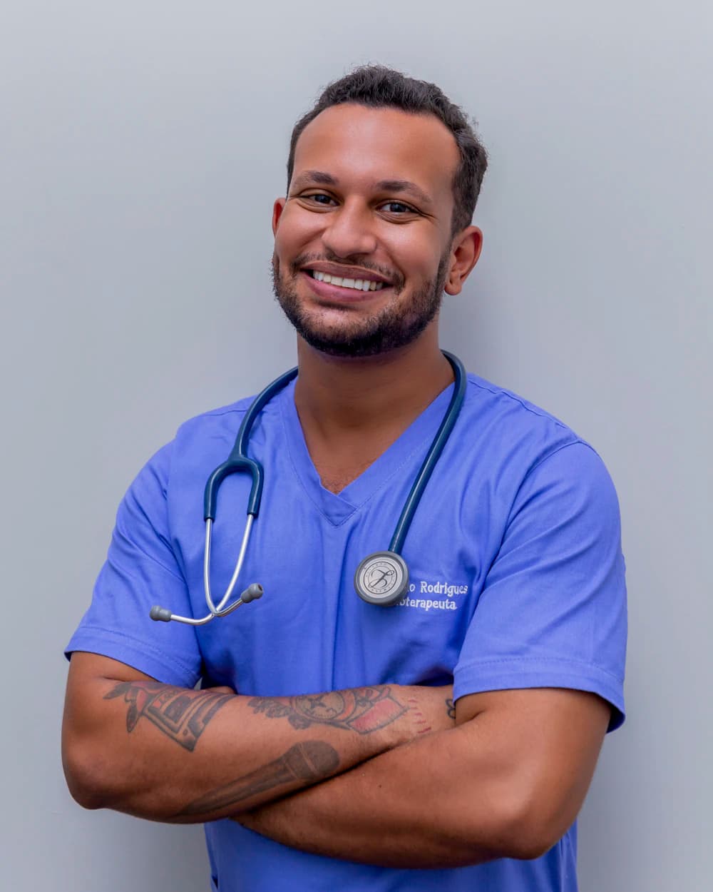 A veterinarian in scrubs